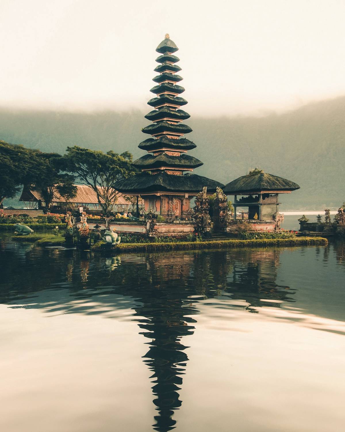 Lake temple in Bali reflected in still water