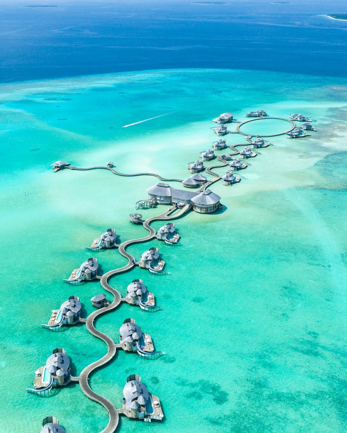 Overwater villas over a turquoise lagoon